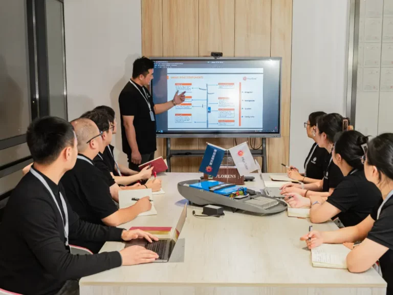 The R&D department is meeting in the conference room, and the supervisor is explaining the new product development content