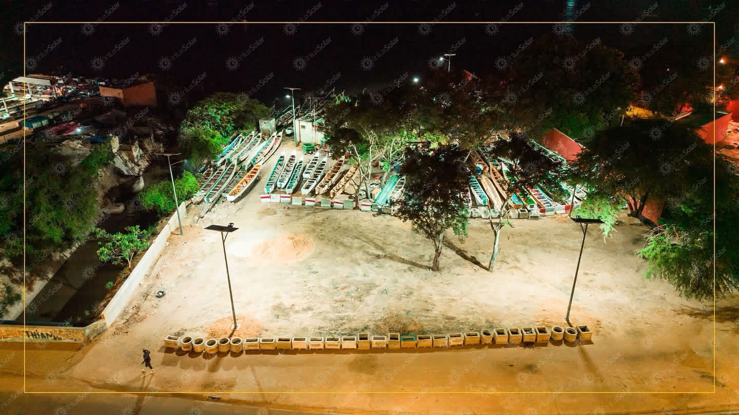 Overhead night view of a fishing area lit by solar street lights