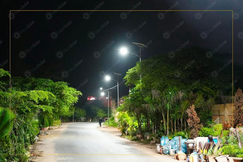 Aerial night view of road and yard lighting from solar street light poles