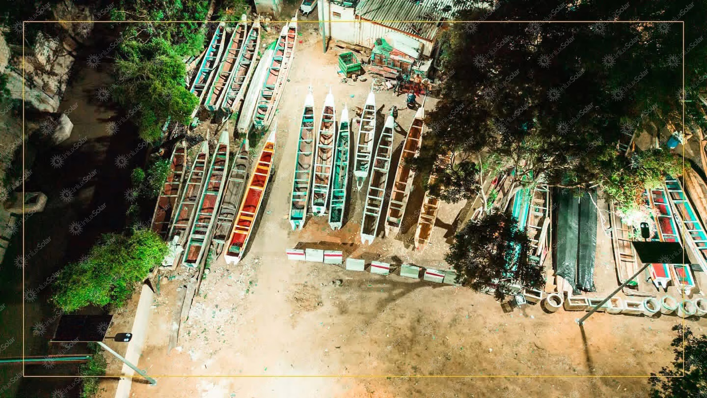 Aerial night view of a fishing-boat yard illuminated by solar street lights