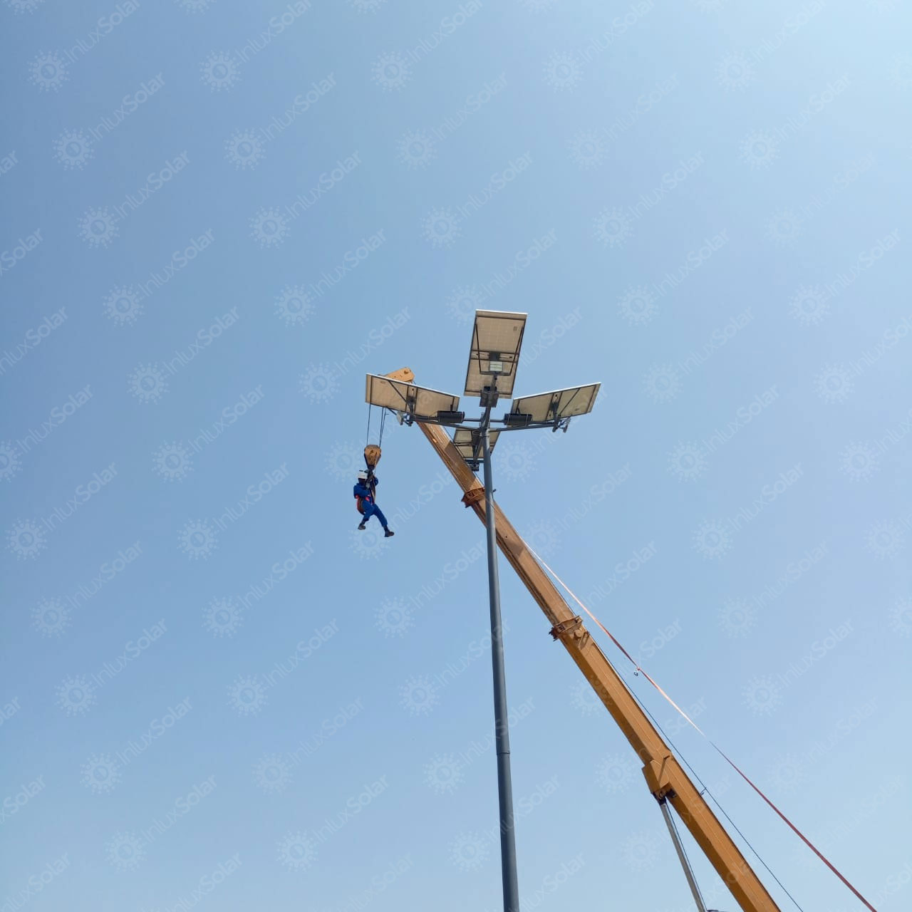 Crane-assisted installation of 15m solar high mast light in South Sudan