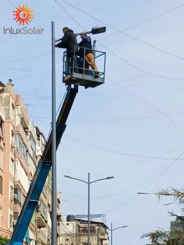 Bucket lift installing an 8m street light pole in Beirut business district