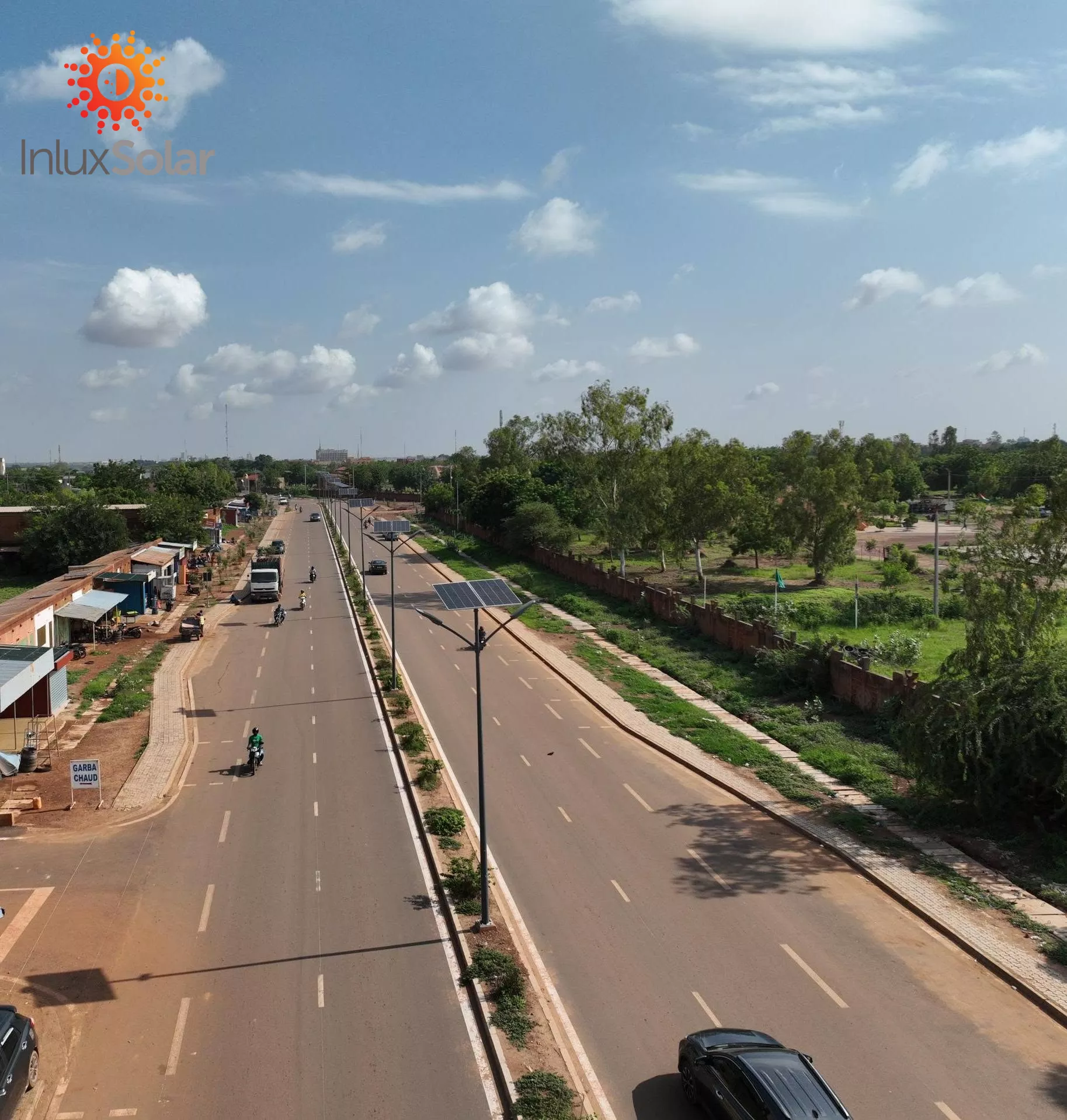 Aerial view of APOLLO solar street lights on the central median of an Ouagadougou main road