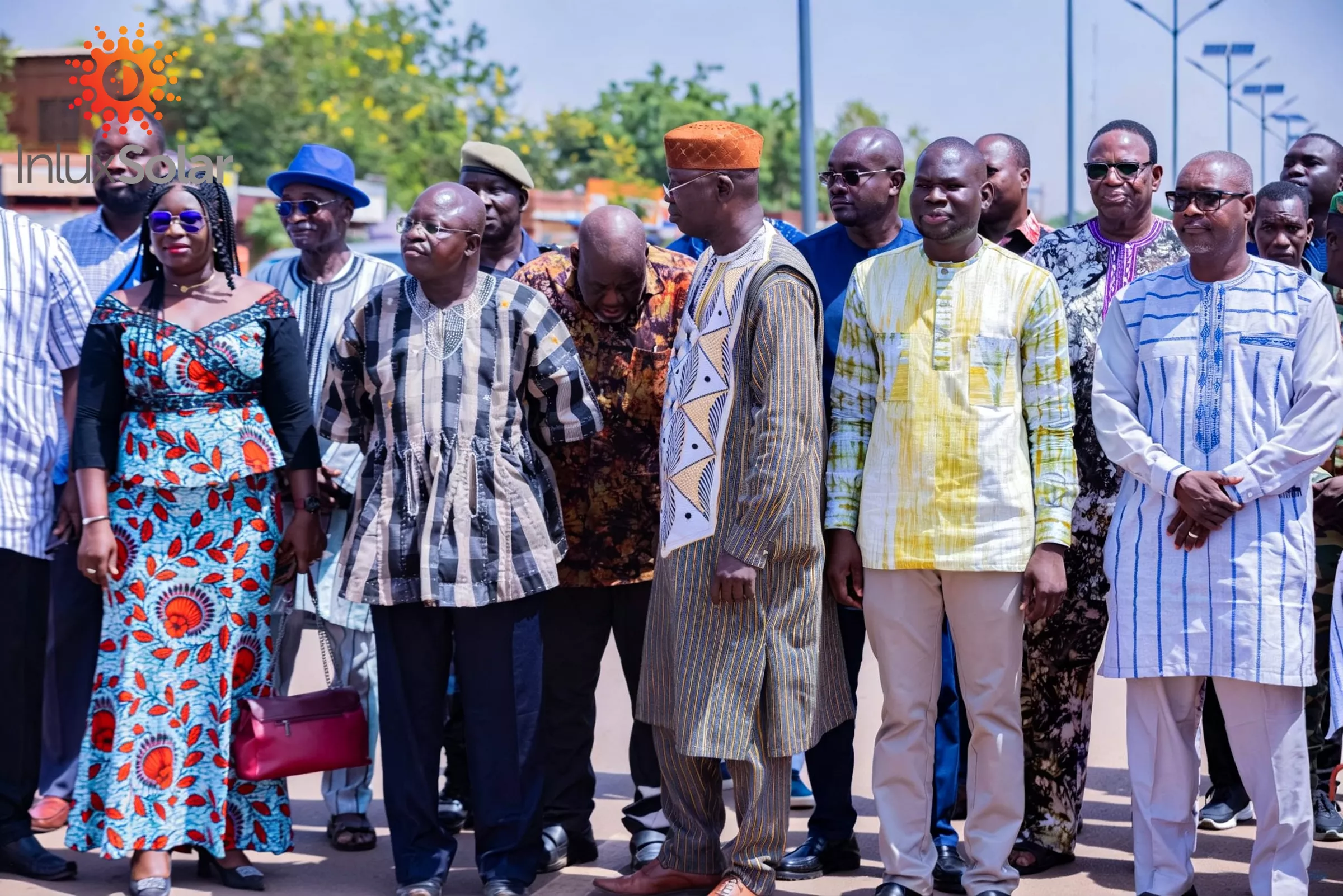 Participants gathered on a completed Ouagadougou road with solar lights behind them